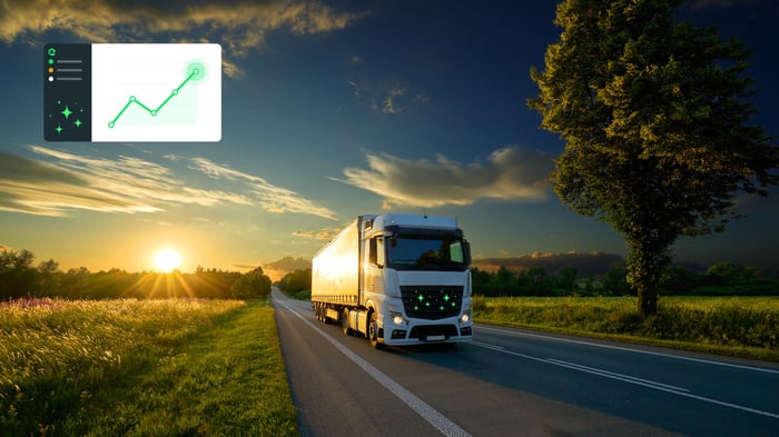 Truck on a road at sunset with an analytics chart overlay
